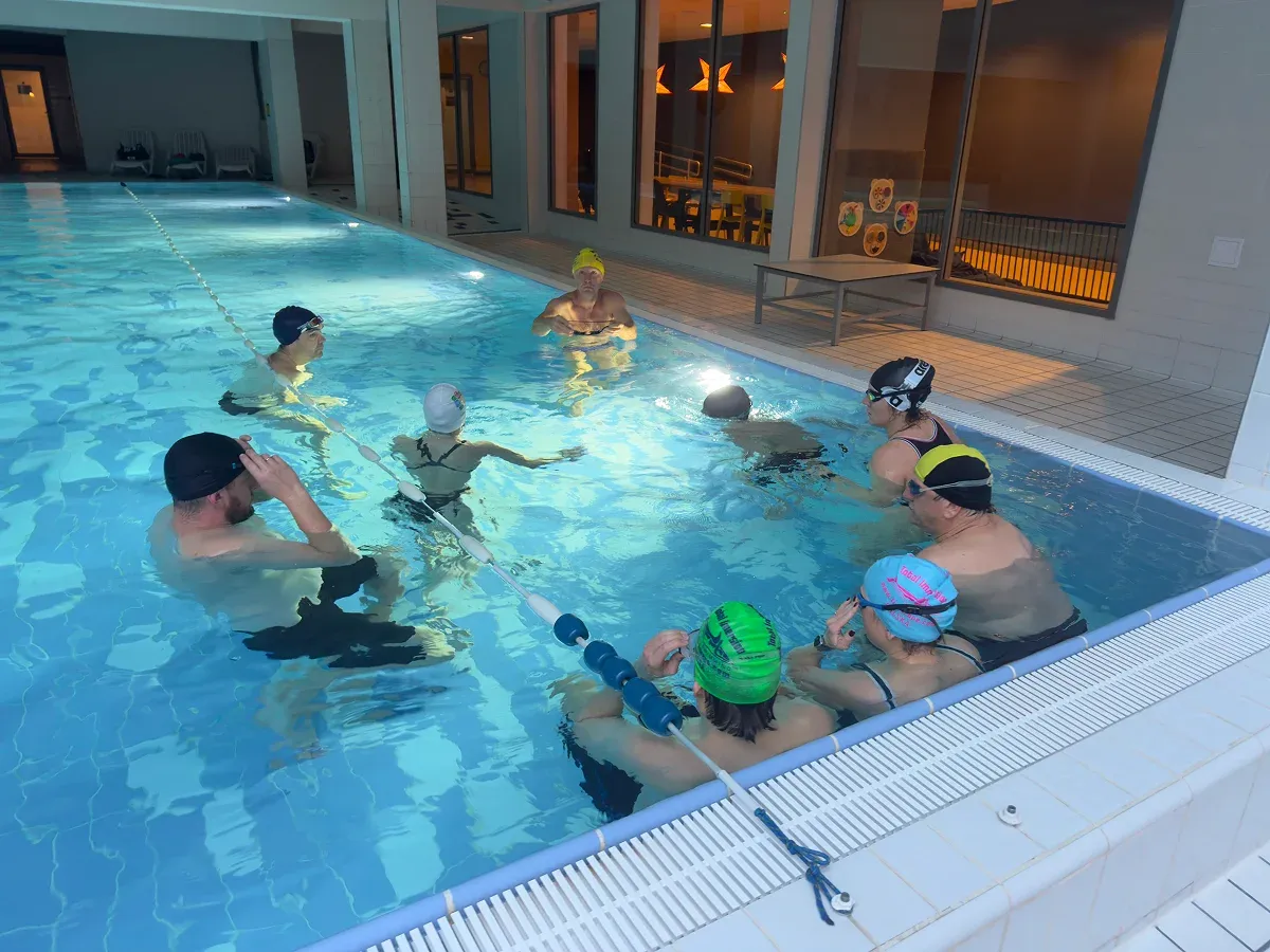 Swimming group training session with BeatBuddy Pro tempo trainer